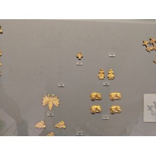 Gold cross-shaped ceremonial ornament